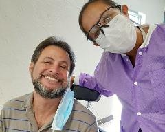 Patient and Dentist smiling at camera